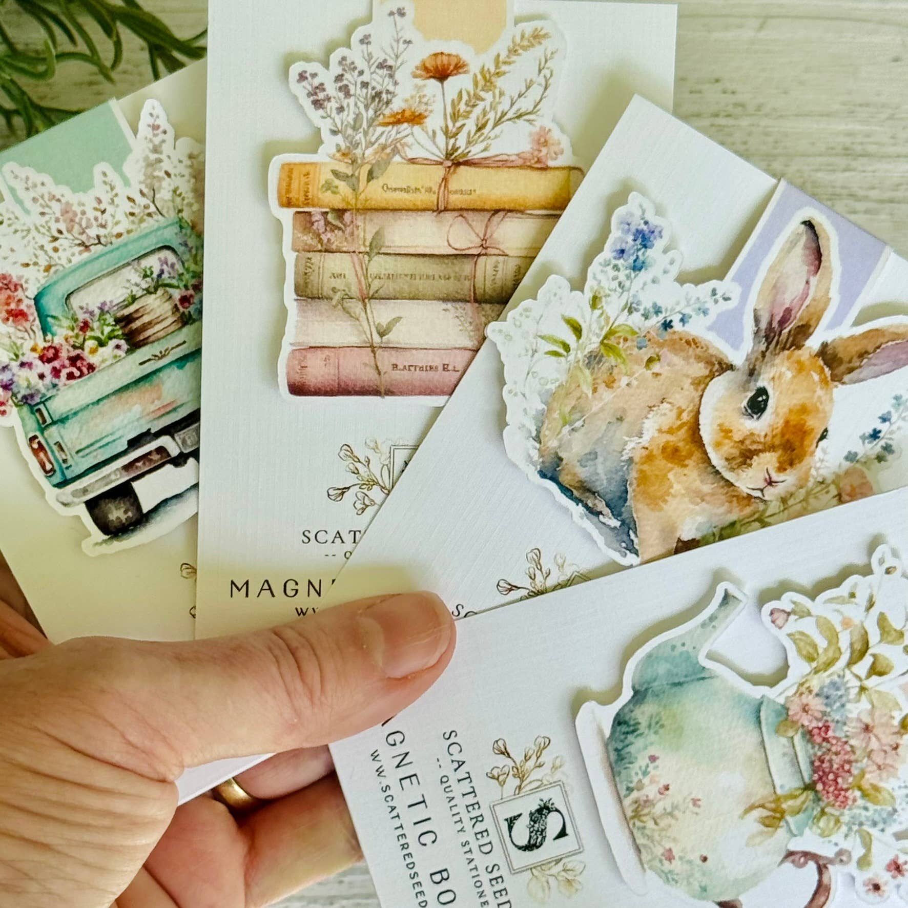 Collection of decorative stickers featuring nature-themed designs on a wooden surface - The Book Keeper & Co