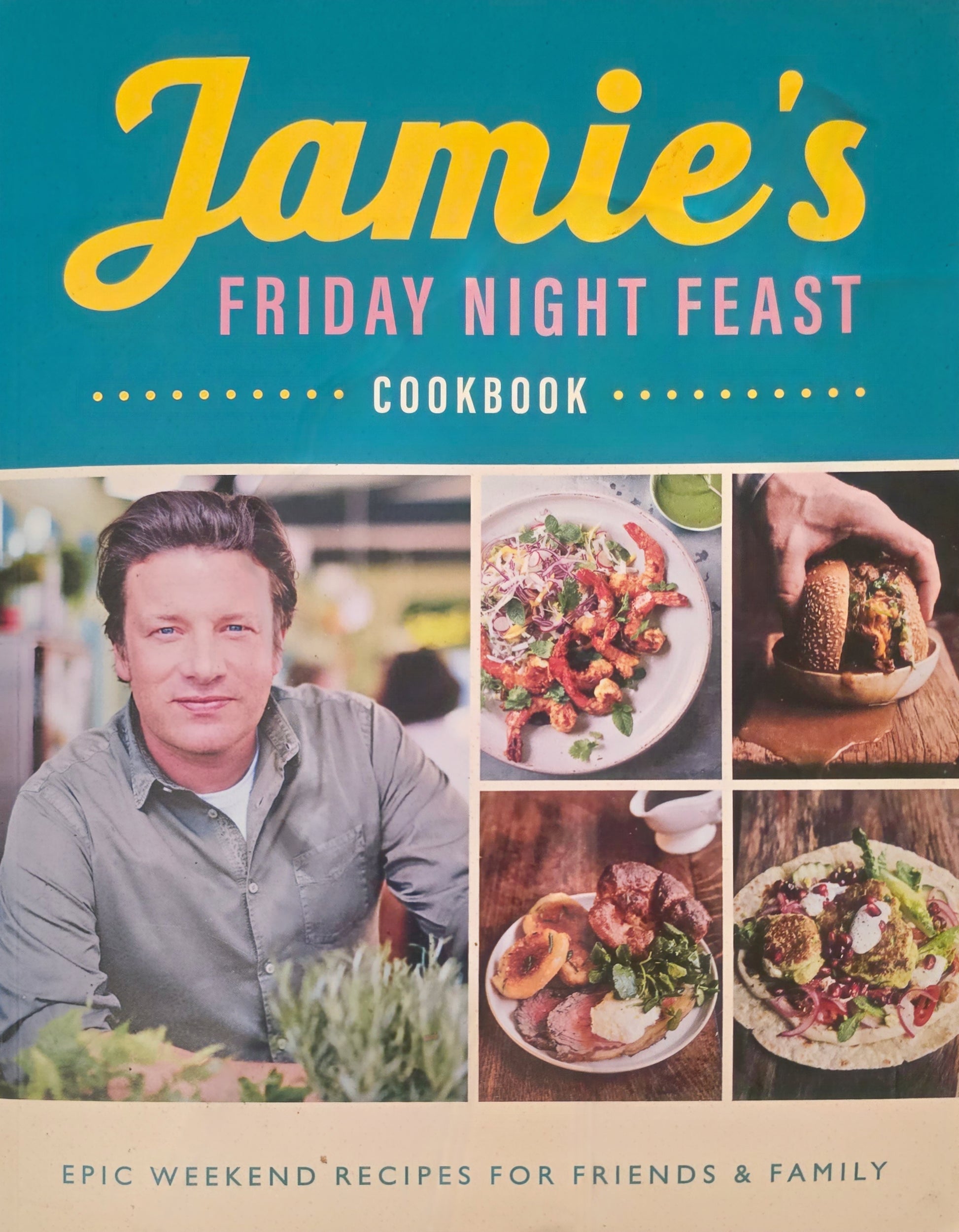 Book cover of 'Jamie's Friday Night Feast Cookbook' with images of food and a person.