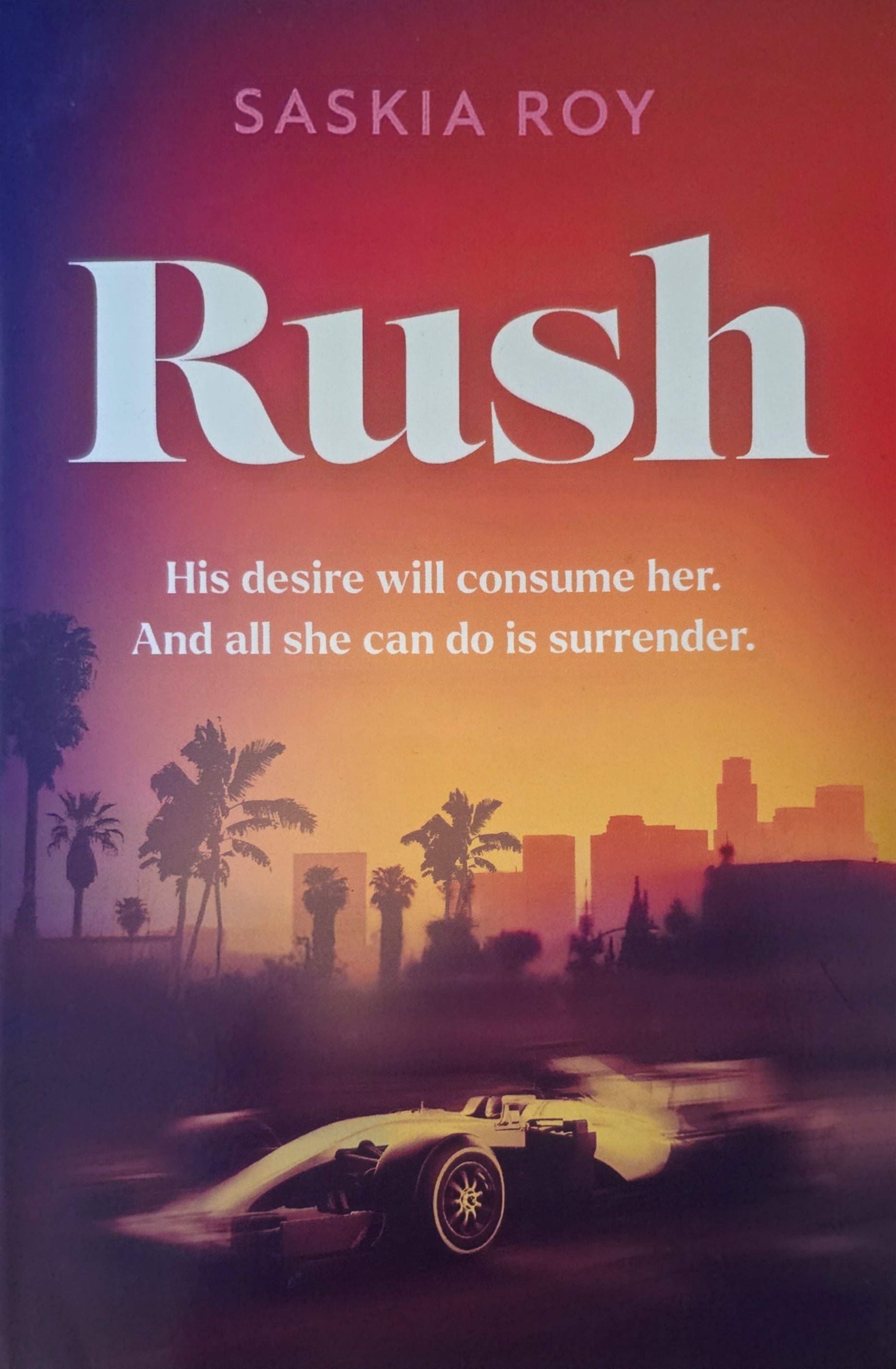 Book cover of 'Rush' by Saskia Roy with a racing car and cityscape.