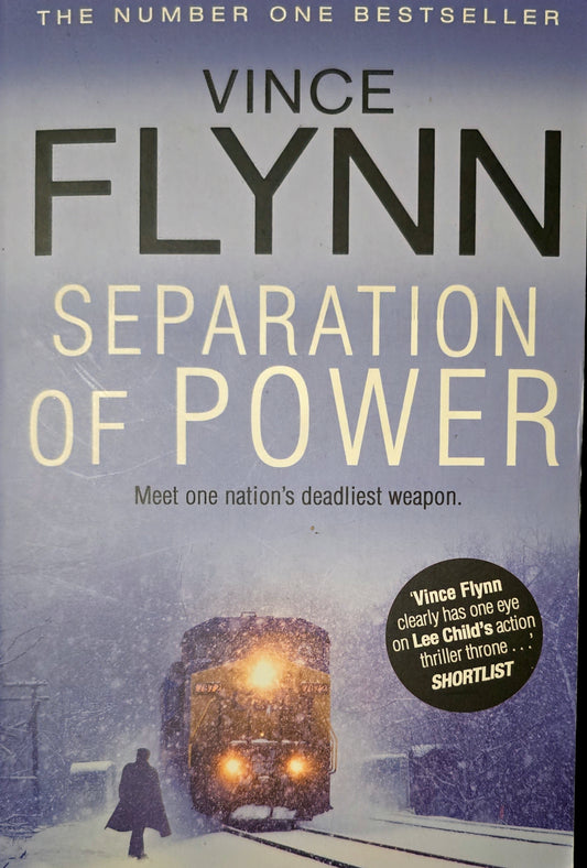 Book cover of 'Separation of Power' by Vince Flynn with a train in a snowy landscape.