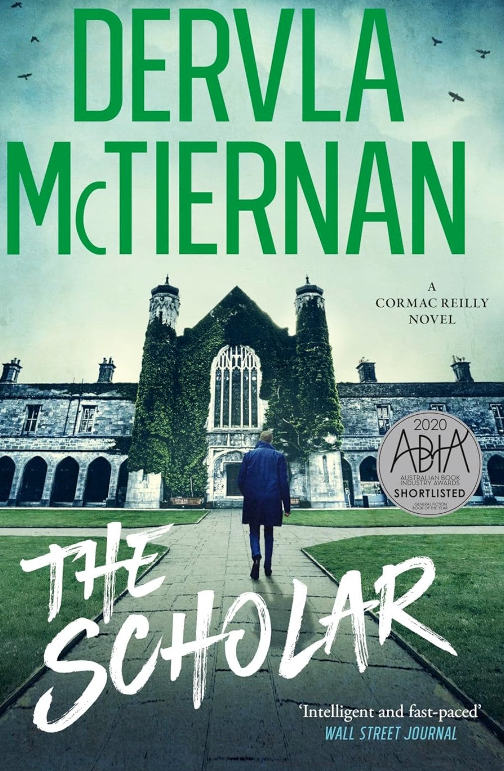 Book cover of 'The Scholar' by Dervla McTiernan featuring a person walking in a courtyard.