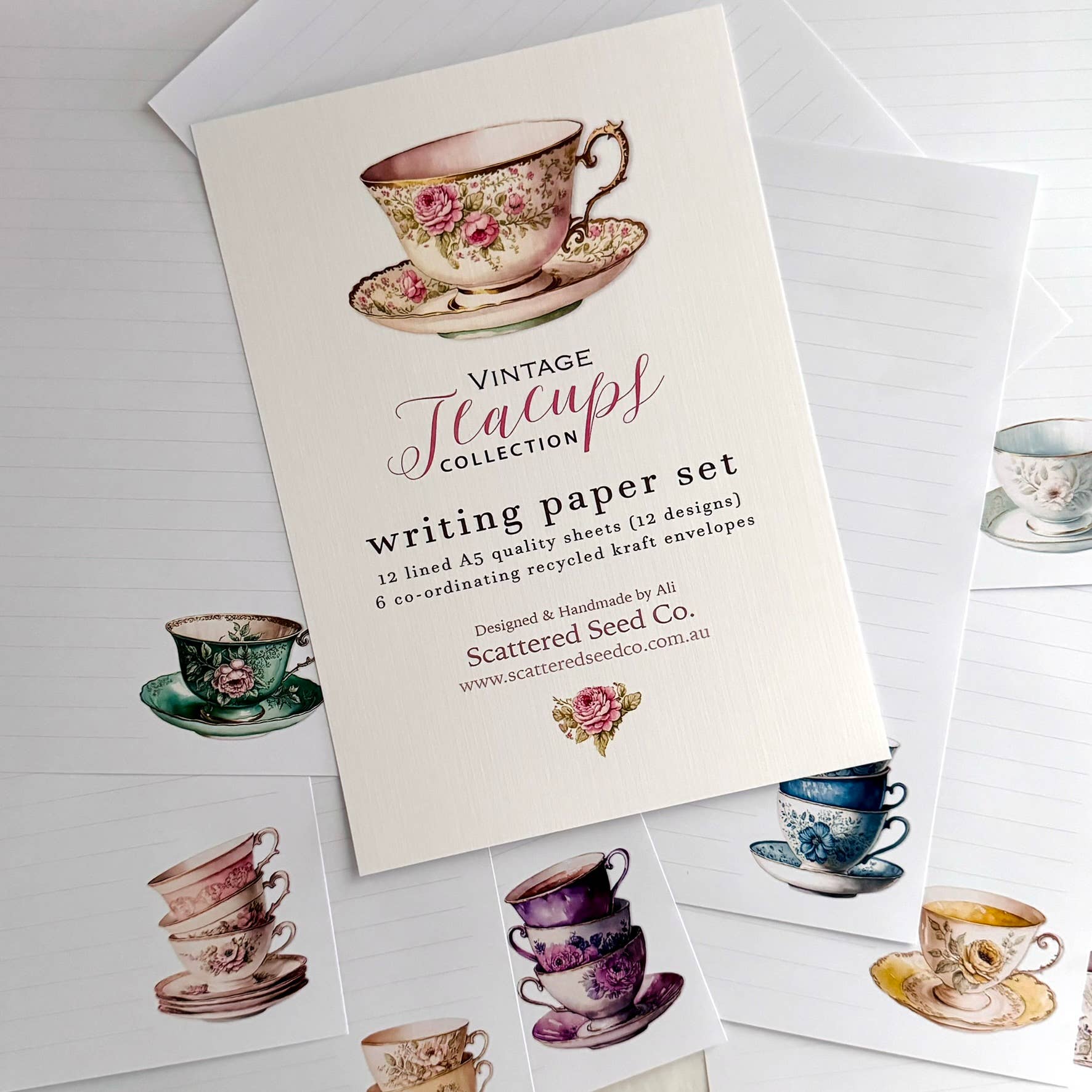 Writing paper set with vintage teacup designs on a white background