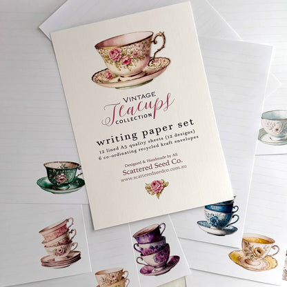 Writing paper set with vintage teacup designs on a white background
