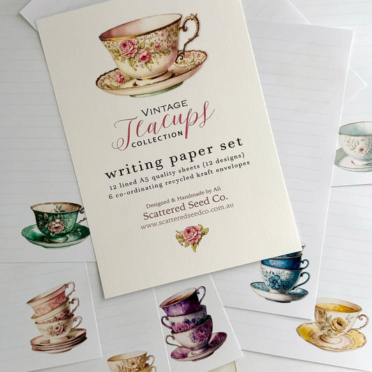 Writing paper set with vintage teacup designs and Scattered Seed Co branding.