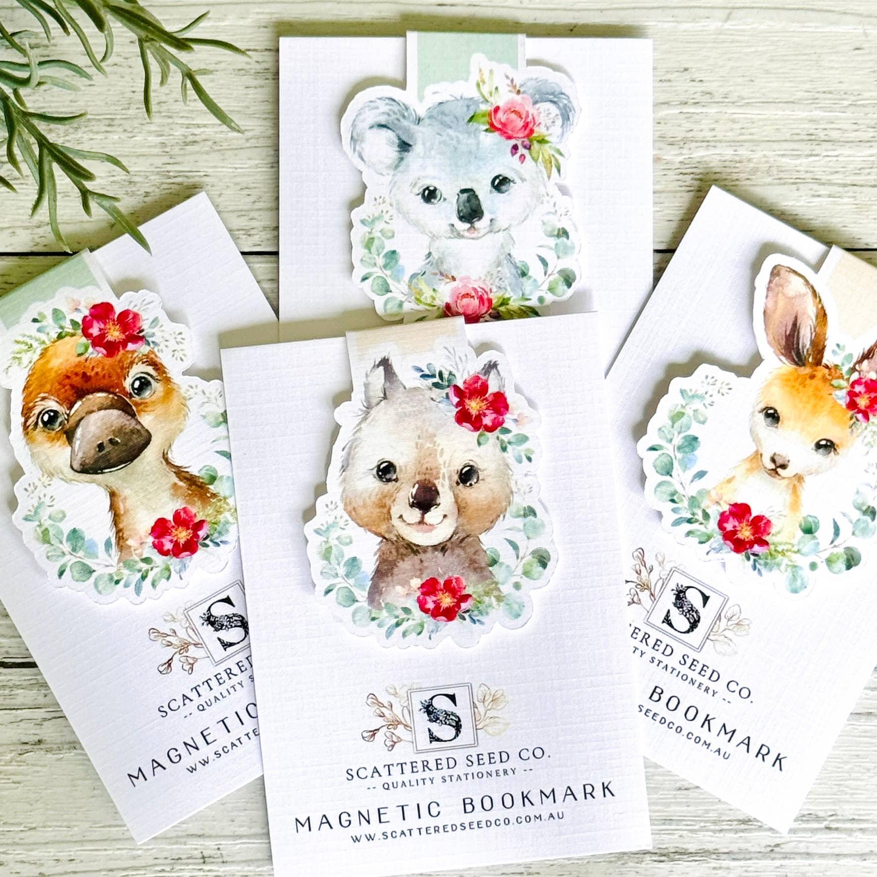Set of magnetic bookmarks with animal illustrations on white cards, branded 'Scattered Seed Co'.