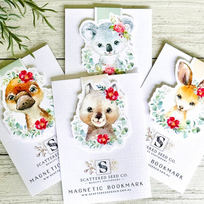 Set of magnetic bookmarks with animal illustrations on white cards, branded 'Scattered Seed Co'.