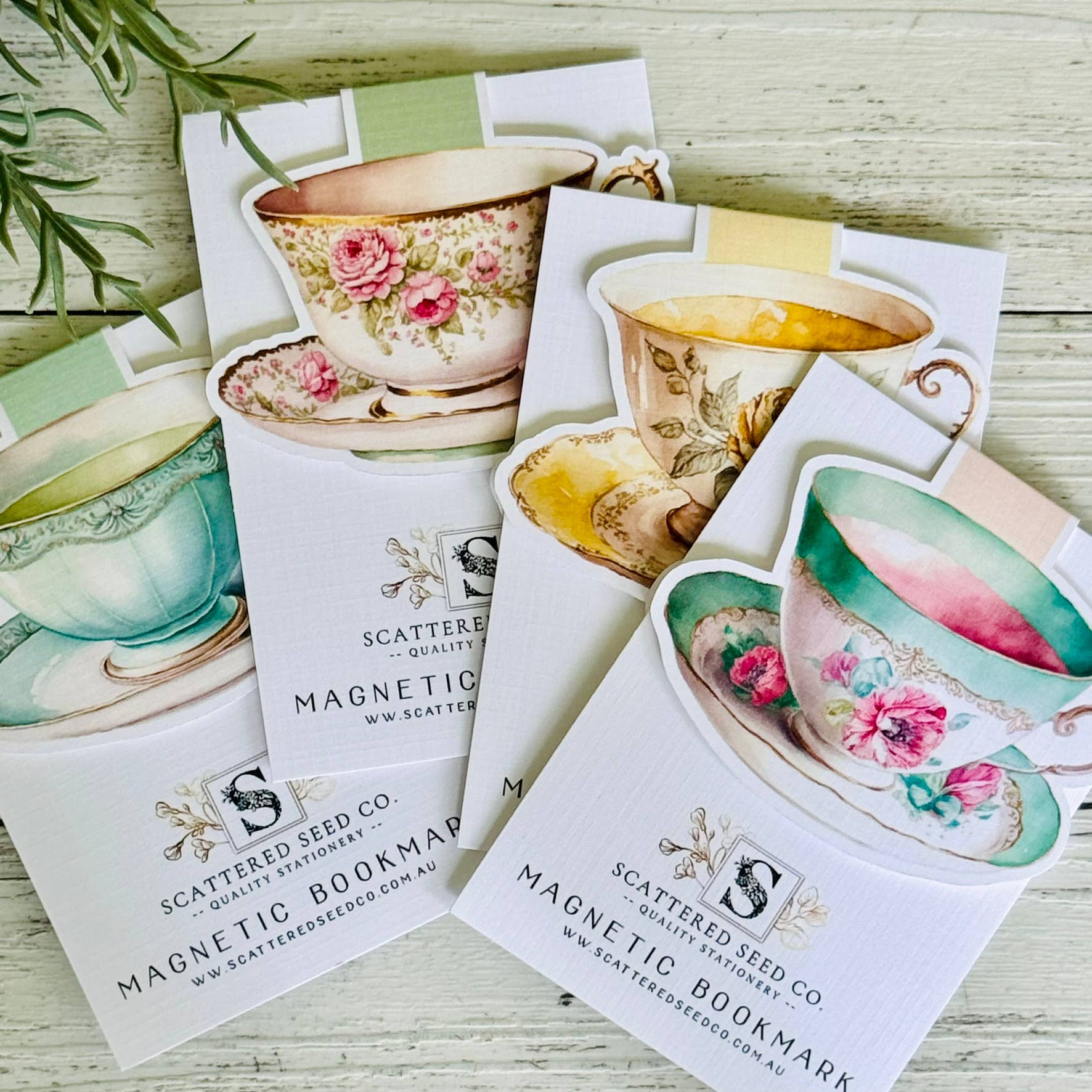 Set of magnetic bookmarks with tea cup designs on a wooden surface - The Book Keeper & Co