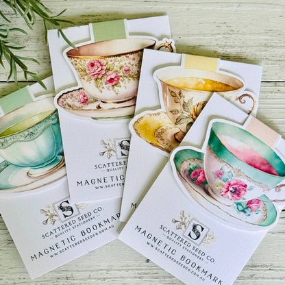 Set of magnetic bookmarks with tea cup designs on a wooden surface - The Book Keeper & Co