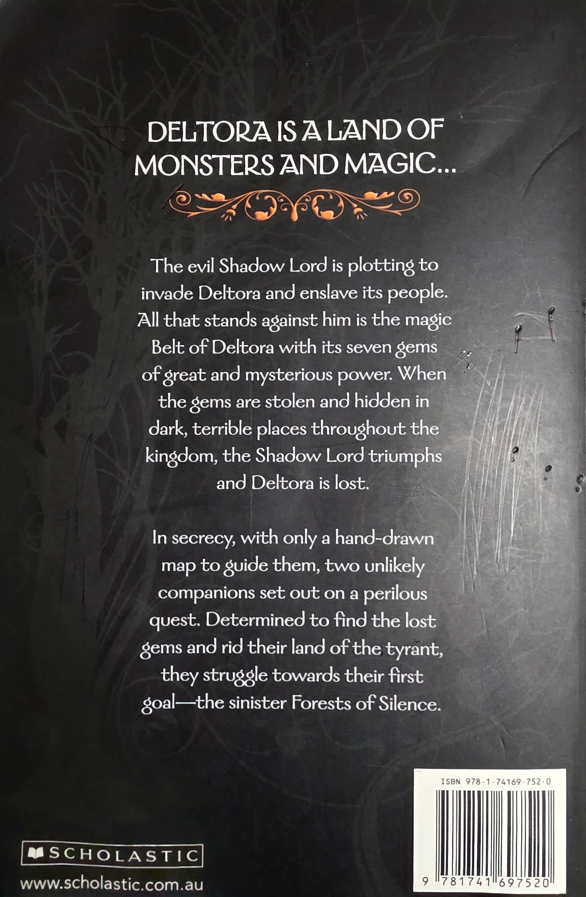 Book back cover with text about Deltora, a land of monsters and magic, featuring Scholastic branding.